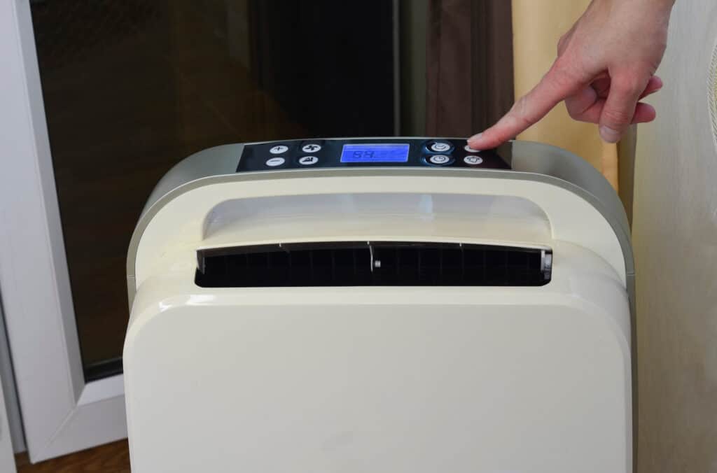 California tenant adjust portable air conditioner when their AC goes out.